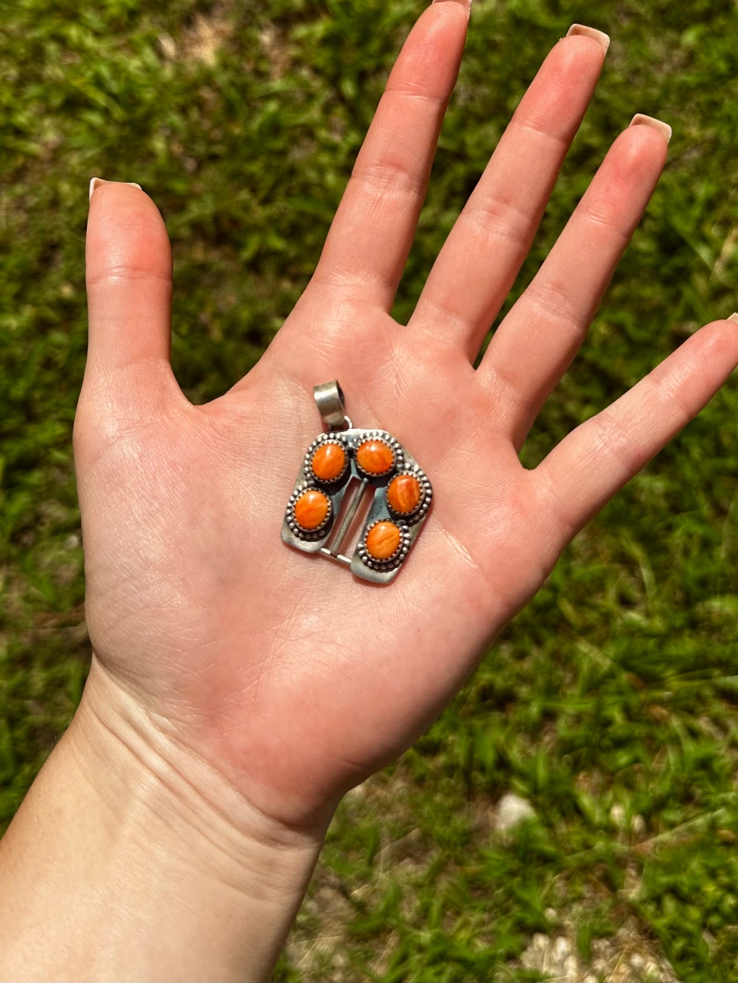 Orange spiny buckle pendant
