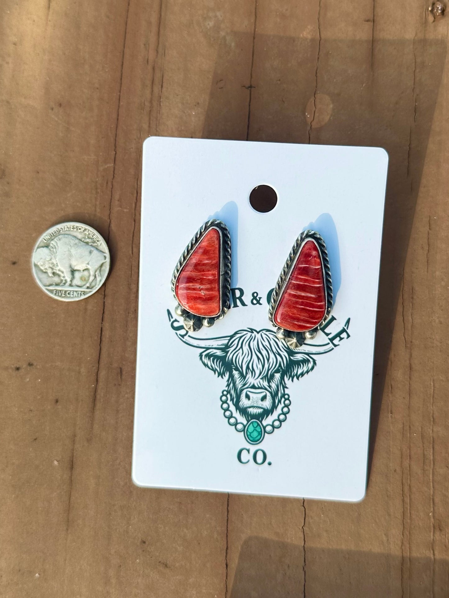 Red spiny oyster earrings made by Navajo artist Chassity Belone ￼