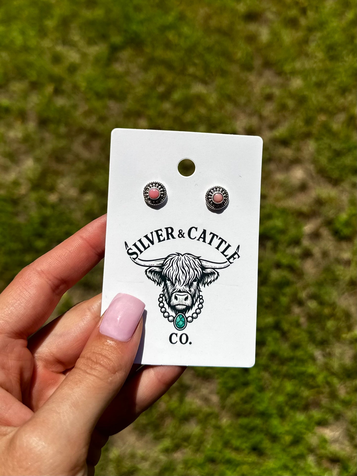 Pink conch stud earrings
