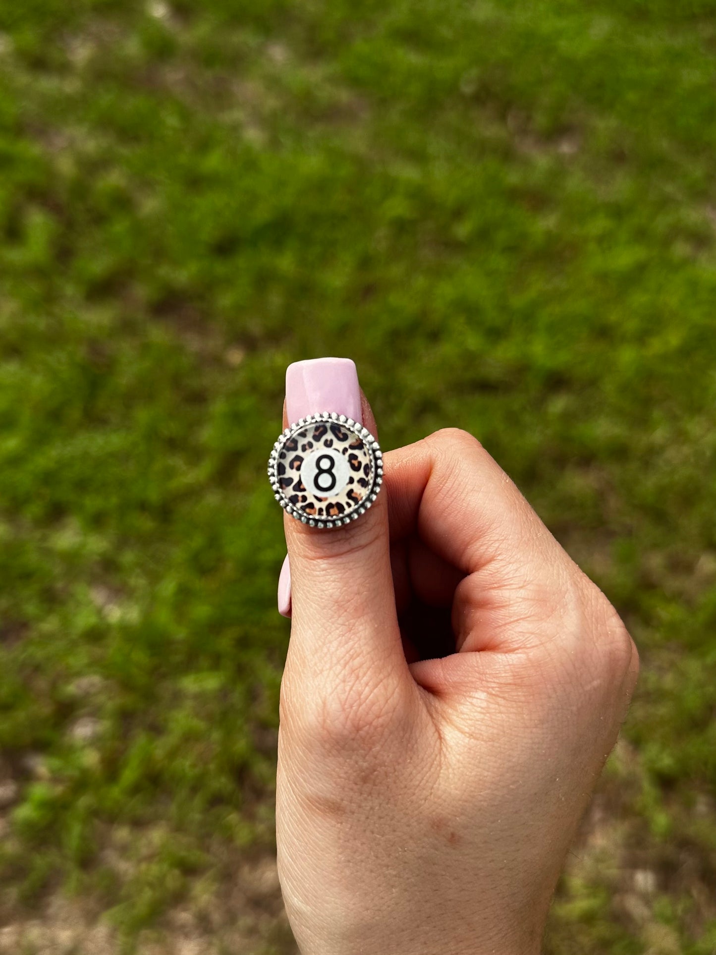 Adjustable cheetah 8 ball ring