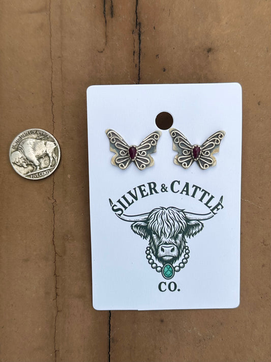 Purple spiny butterfly earrings
