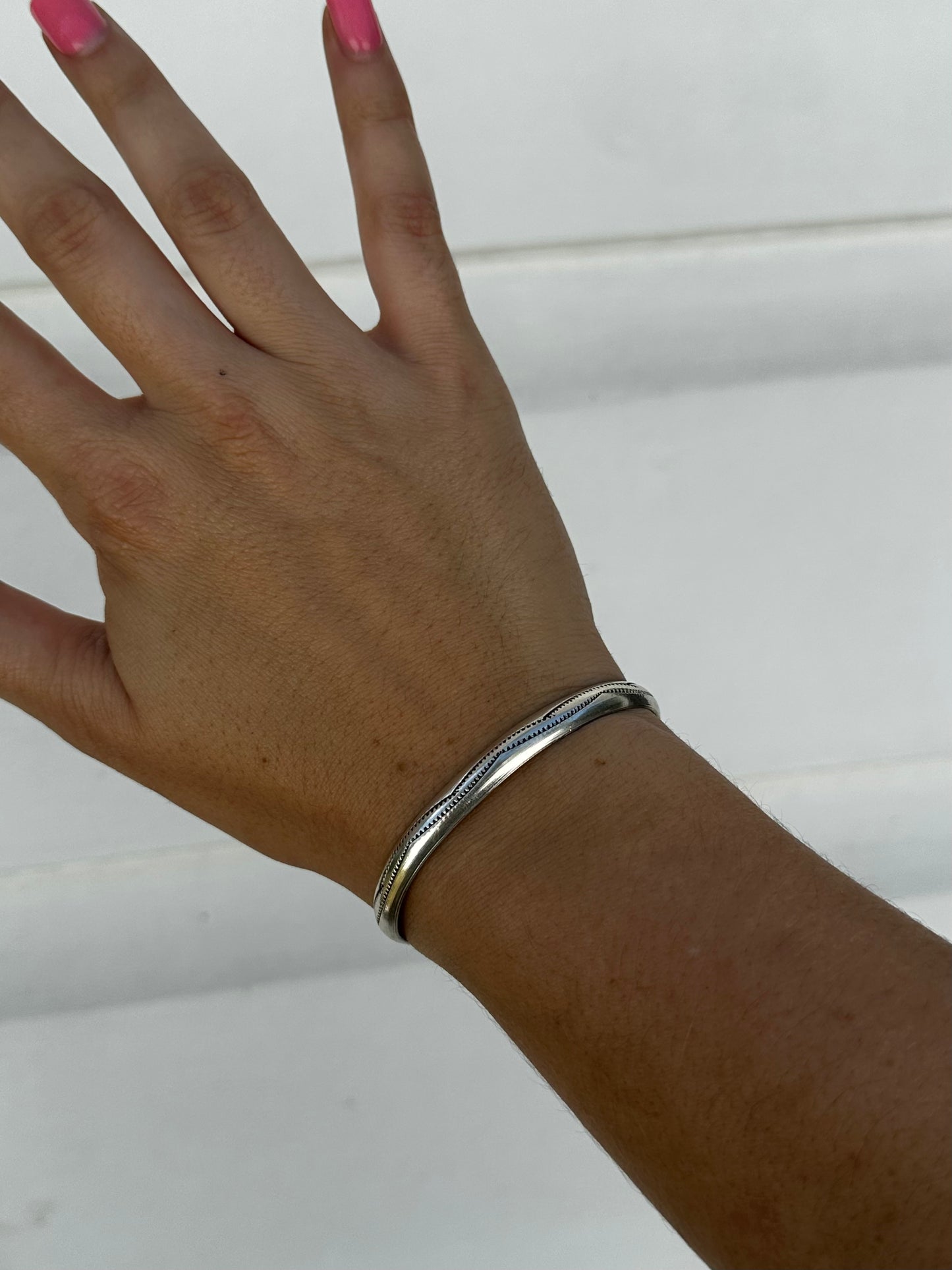 Silver stamped cuff by Navajo artist Aline Tahe