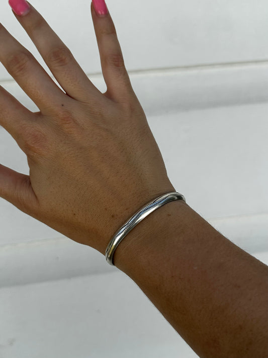 Silver stamped cuff by Navajo artist Aline Tahe