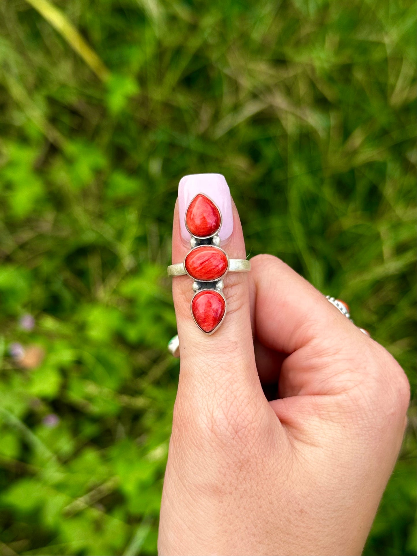 Adjustable red spiny ring