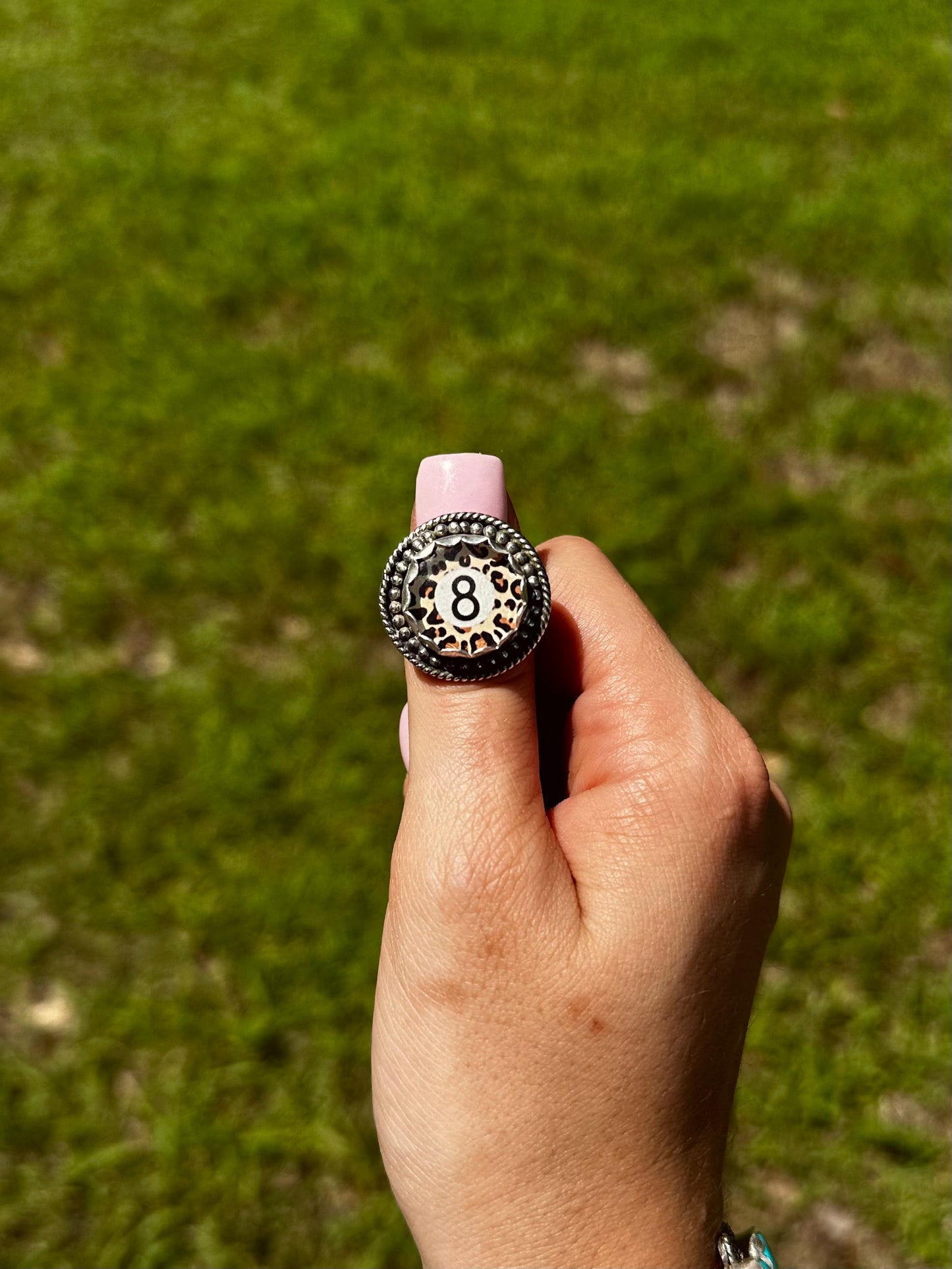 Adjustable cheetah 8 ball ring